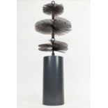 SCULPTURE, 20th century, with intricate spiralled metalwork on cylindrical composite base,