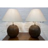 TABLE LAMPS, a pair, carved hardwood with height adjustable bulb holders and linen shades, 74cm H.