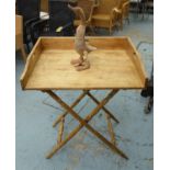TRAY TABLE AND DUCK, on a folding stand, 80cm W x 60cm D x 94cm H and a wooden duck, 51cm H.