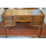 WRITING TABLE, early 20th century Georgian style mahogany with green leather top above five drawers,