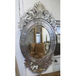 WALL MIRROR, 19th century Venetian of substantial proportions with central oval plate,