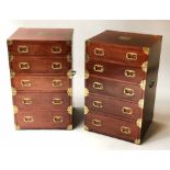 BEDSIDE CHESTS, a pair, mahogany and brass bound, each with five drawers and pierced handles,