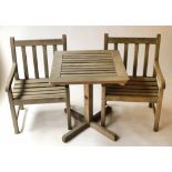 GARDEN ARMCHAIRS AND LISTER TABLE, a pair,