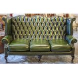 SOFA, Georgian style in green leather, 105cm H x 181cm.