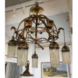 CHANDELIER, late 19th century Art Nouveau gilt bronze with seven hanging lights and drop glass rods,