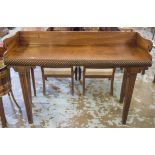 IRISH SERVING TABLE, early 19th century 'Cork' mahogany, with distinctive spiral carved frieze,