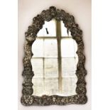 WALL MIRROR, 19th century Italian silvered brass with arched repoussé frame, 103cm H x 64cm.