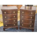 BOWFRONT BEDSIDE CHESTS, a pair, Georgian style, each with four drawers, 75cm H x 50cm x 39cm.