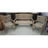 GARDEN BENCH, grey painted with trellis back 126cm W and a pair of matching armchairs 64cm W.