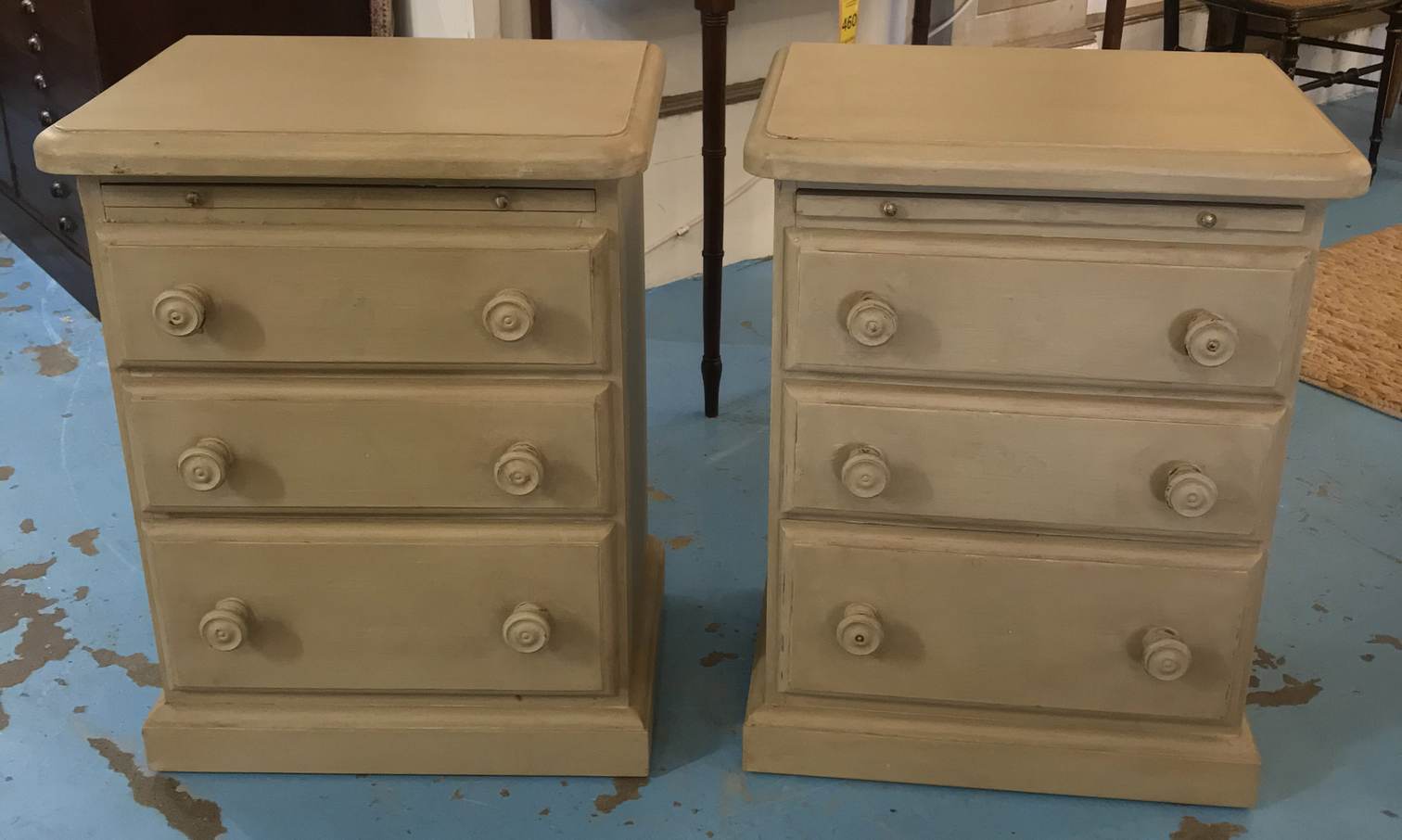 BEDSIDE CHESTS, a pair, each with three drawers and brushing slide in a grey painted finish,
