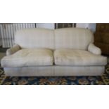 SOFA, cream and white check fabric, with twin seat cushions, beech legs and brass castors,