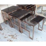 NEST OF TABLES, two sets of three, 1960's French style, black glass tops on copper finish bases,