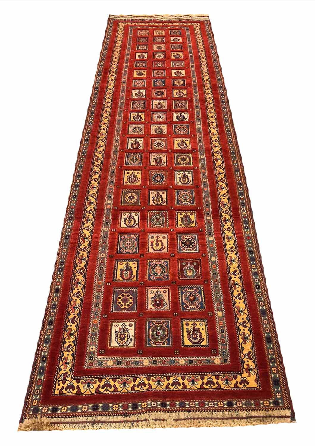 FINE PERSIAN QASHQAI RUNNER, 308cm x 84cm, repeat square medallions within matching borders.
