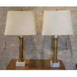 TABLE LAMPS, a pair, circa 1970, brass, cylindrical with square marble bases and shades,