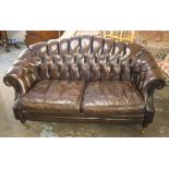 SOFA, dark brown leather with buttoned back and twin seat cushions, 164cm W.