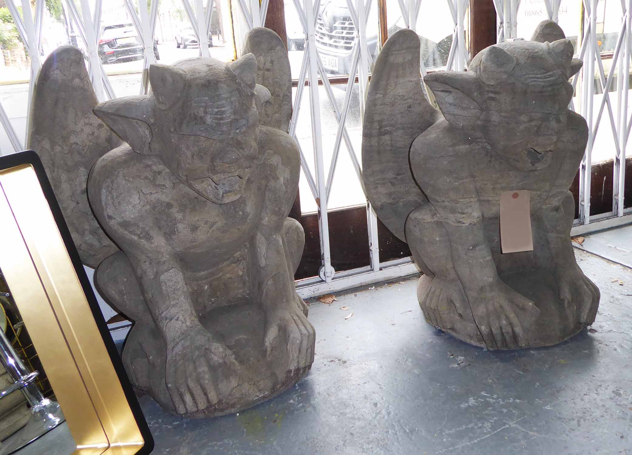 COMPOSITE STONE GROTESQUE GARGOYLES, a pair, 70cm H.