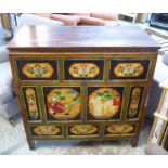 TIBETAN CABINET, with three drawers over a cupboard with hand painted polychrome traditional scenes,