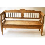 HALL SETTLE, vintage continental pine with spindle raised back and arms and hinged seat, 151cm W.