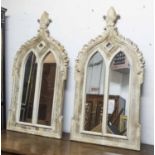 WALL MIRRORS, a pair, distress painted in Gothic style, 116cm x 61cm.
