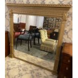 OVERMANTLE MIRROR, late Victorian with a classical giltwood and gesso frame, 133cm W x 136cm H.
