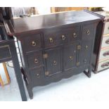 CHINESE SIDE CABINET, with seven drawers and a cupboard, 102cm W x 41cm D x 88cm H.