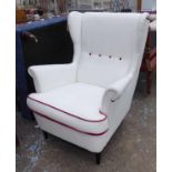 WING BACK ARMCHAIR, 1960's Italian style white with red button and piping detail, 100cm x 84cm W.