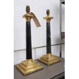 TABLE LAMPS, a pair, column form in onyx and gilt brass, marked 'FR' to the base, 52cm H.