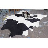 BOVINE HIDE FLOOR RUG AND BAG, 240cm x 200cm approx.