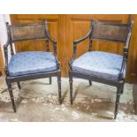 OPEN ARMCHAIRS, a set of four, Regency style ebonised with caned backs,
