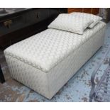 OTTOMAN, upholstered in tufted light teal patterned fabric with rising lid and two scatter cushions,