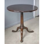 TRIPOD TABLE, George III mahogany with circular tilt top, 69cm H x 67cm.