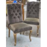 DINING CHAIRS, a set of four in button backed grey velvet.