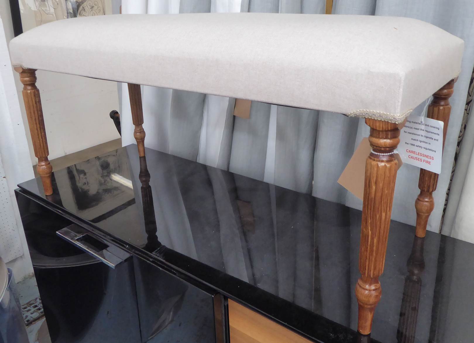 HALL SEAT, English country house style linen cover on reeded supports, 98cm x 40cm x 43cm.