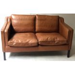 STOUBY SOFA, Danish 1970's design fine piped tan leather upholstered with shaped side cushions,