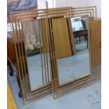 WALL MIRRORS, a pair, gilt metal with rectangular tubular frames, 115cm x 85cm.