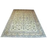 FINE KASHAN CARPET, 430cm x 295cm, jade field of scrolling vines and palmettes.