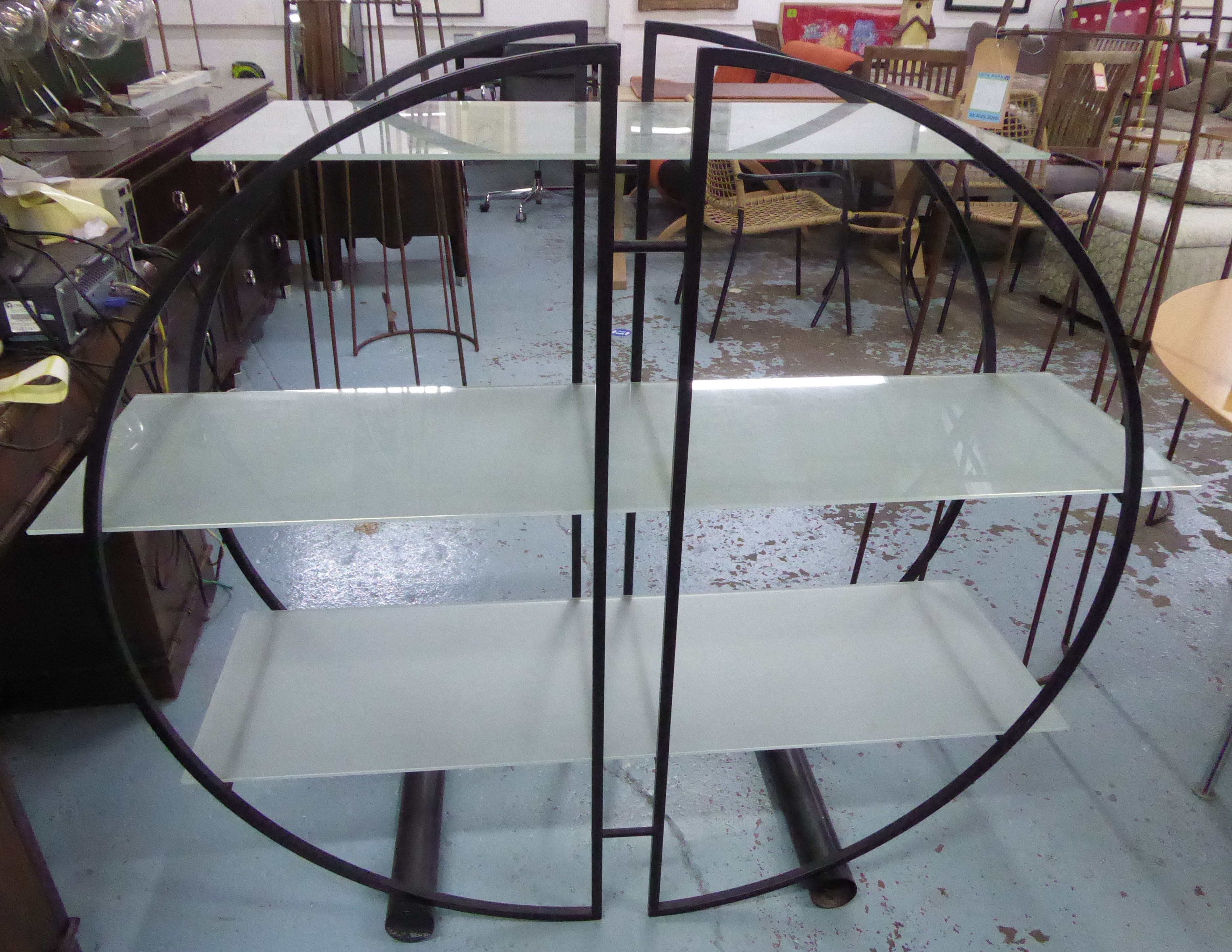 DISPLAY SHELVES, circular black framed with three opaque glass shelves, 137cm x 42cm x 120cm.