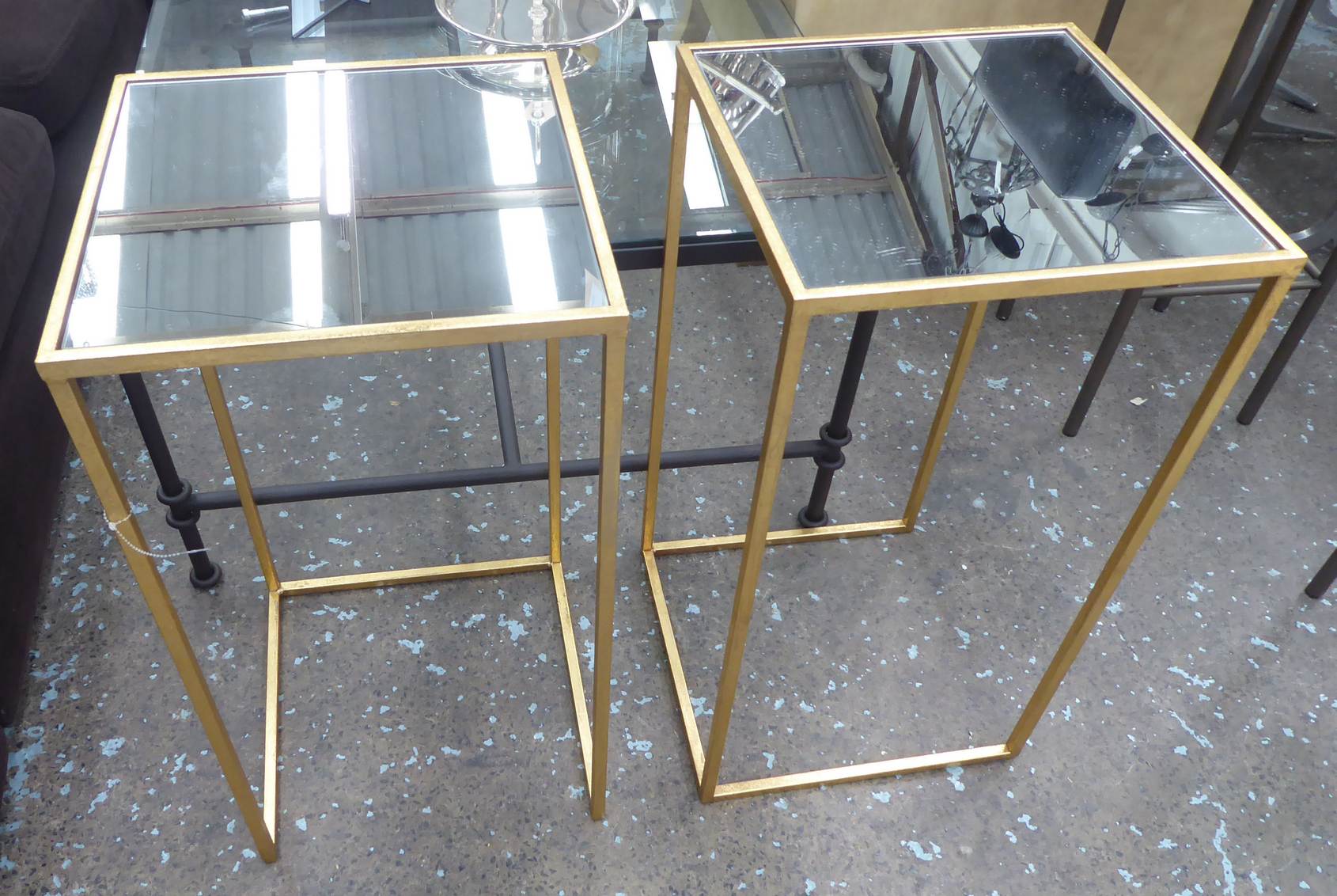 SIDE TABLES, two, gilt metal frames with mirrored inserts, 67cm H x 35cm x 35cm.