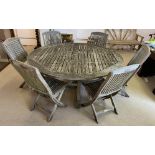 INDIAN OCEAN GARDEN TABLE, weathered teak, 180cm diam x 74cm H, and six matching folding chairs.