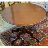 LOW TABLE, antique mahogany with circular top on reduced pedestal, 54cm H x 67cm.