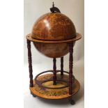 GLOBE COCKTAIL CABINET, in the form of an antique terrestrial globe on stand with rising lid,