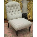 NURSING CHAIR, Victorian ebonised in button backed ticking on castors, 55cm W.