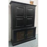 BOOKCASE, in an ebonised finish with fitted shelves and mesh grill doors to the base,