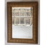 RICO WALL MIRROR, Art Deco style rectangular bevelled mirror in broad gilt and painted stripe frame,