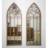 WALL MIRRORS, a pair, Gothic style, rust metal framed, 115cm x 40cm.