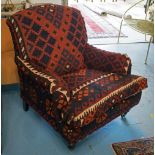 ARMCHAIR, red kilim upholstered with cushion seat and castors, 87cm W.