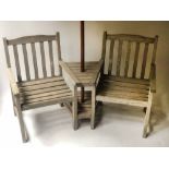 CONVERSATION BENCH, weathered teak two conjoined armchairs with centre table and parasol, 155cm W.