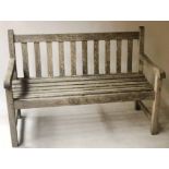 GARDEN BENCH, silvery weathered teak of slatted construction, 122cm W.