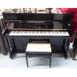 YAMAHA B2 UPRIGHT PIANO, serial no. J26175316, ebonised case, 148cm x 56cm x 110cm H with stool.