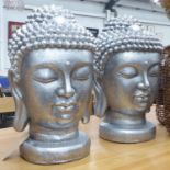 BUDDHA HEADS, a pair, of large proportions, contemporary silvered finish, 60cm H.